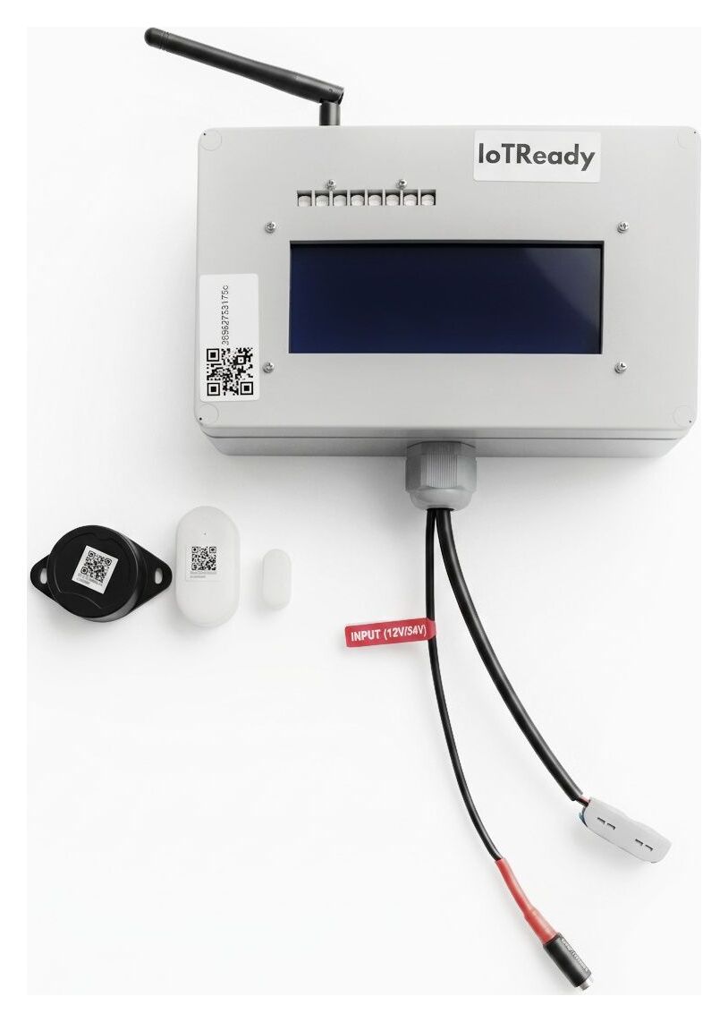 IoTReady Cold Chain Gateway wall unit with a ColdTag and a door sensor laid out beside it